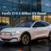 Ford electric vehicle outside corporate headquarters symbolising Ford’s $19.5 billion EV restructuring and strategic reset in 2025